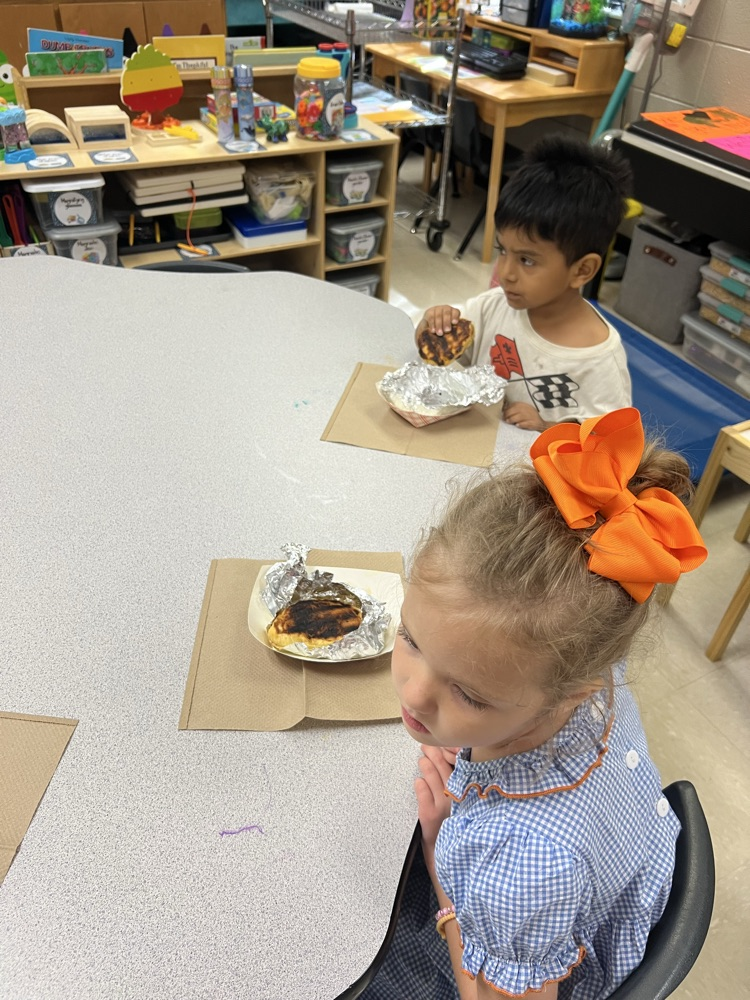 Pre-K students making apple pies with Mrs. Carver!