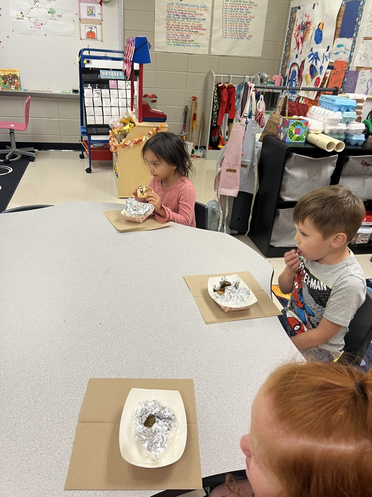 Pre-K students making apple pies with Mrs. Carver!