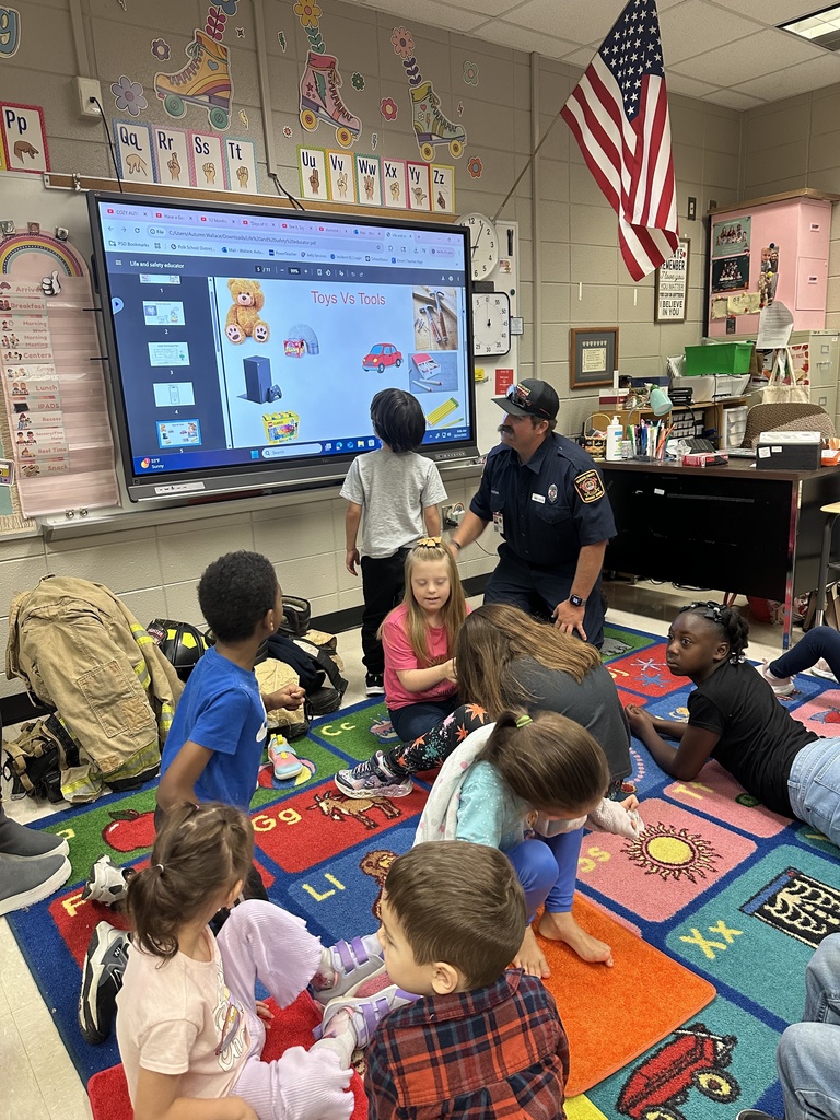 Mrs. Irvin's class listening to the firefighter read.