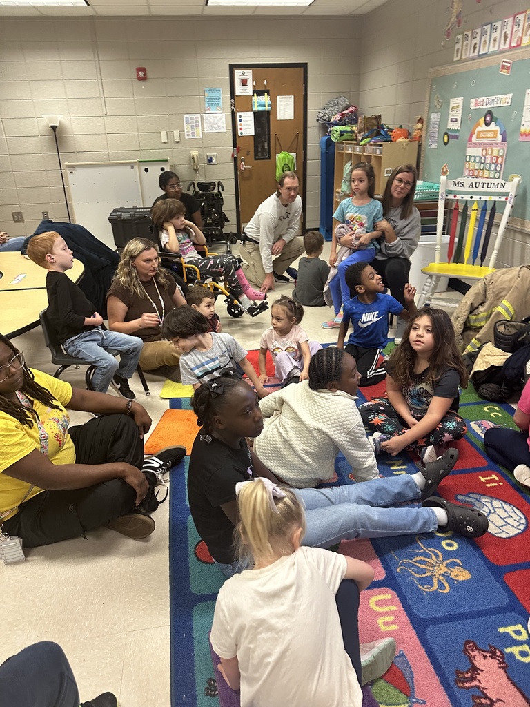 Mr. Hall's class listening to the firefighter read.