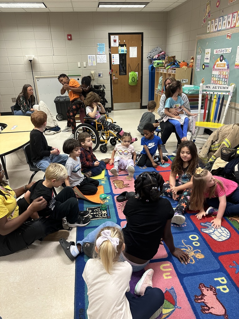 Mr. Hall's class listening to the firefighter read.