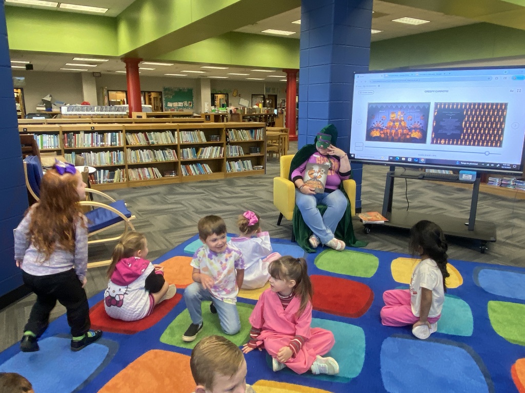 Sandra's mom reading to her class as a "mystery" reader. 