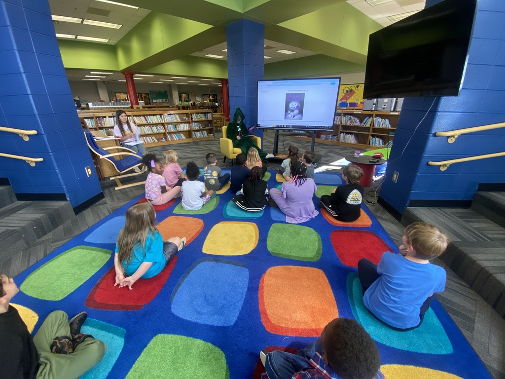 Charlie's mom reading to Ms. Porter's class. 