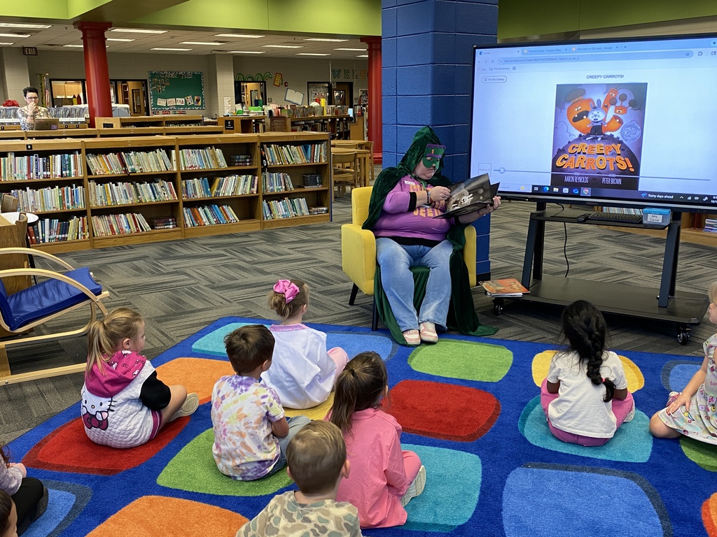 Sandra's mom reading to her class as a "mystery" reader. 