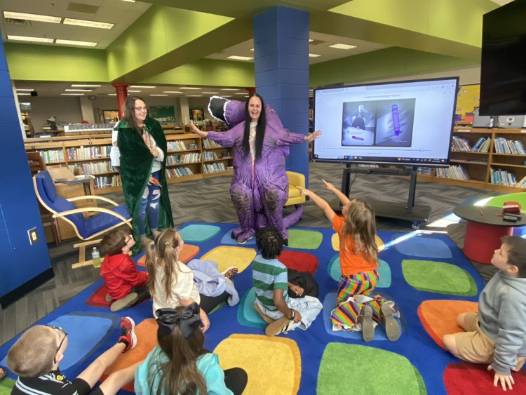 Mrs Guthrie’s Dino mystery reader reading to her students.