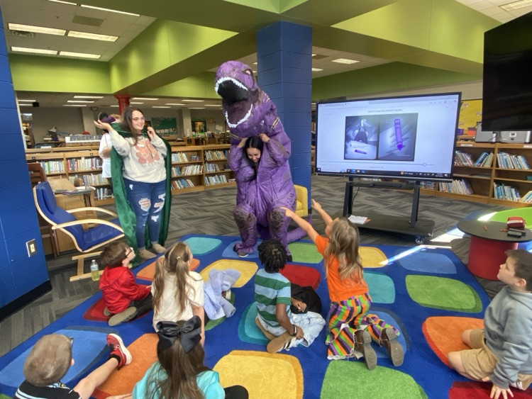 Mrs Guthrie’s Dino mystery reader reading to her students. surprise uncovering she was Raelynn’s grandmother