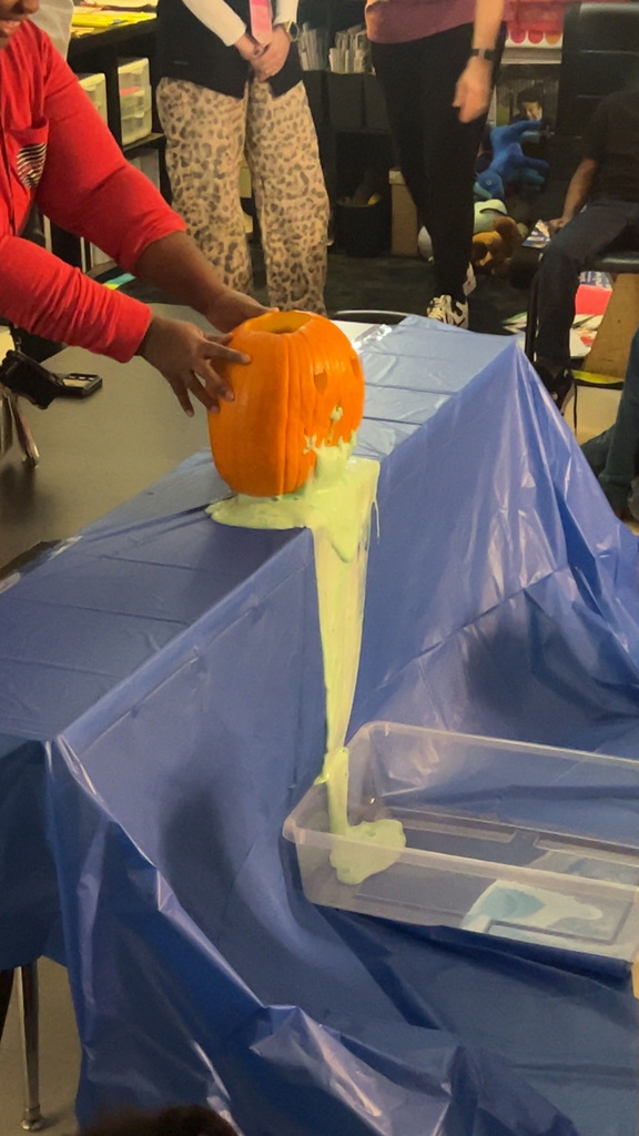 Pumpkin science with kindergarteners - Picture of a pumpkin exploding yellow ooze out it's mouth.
