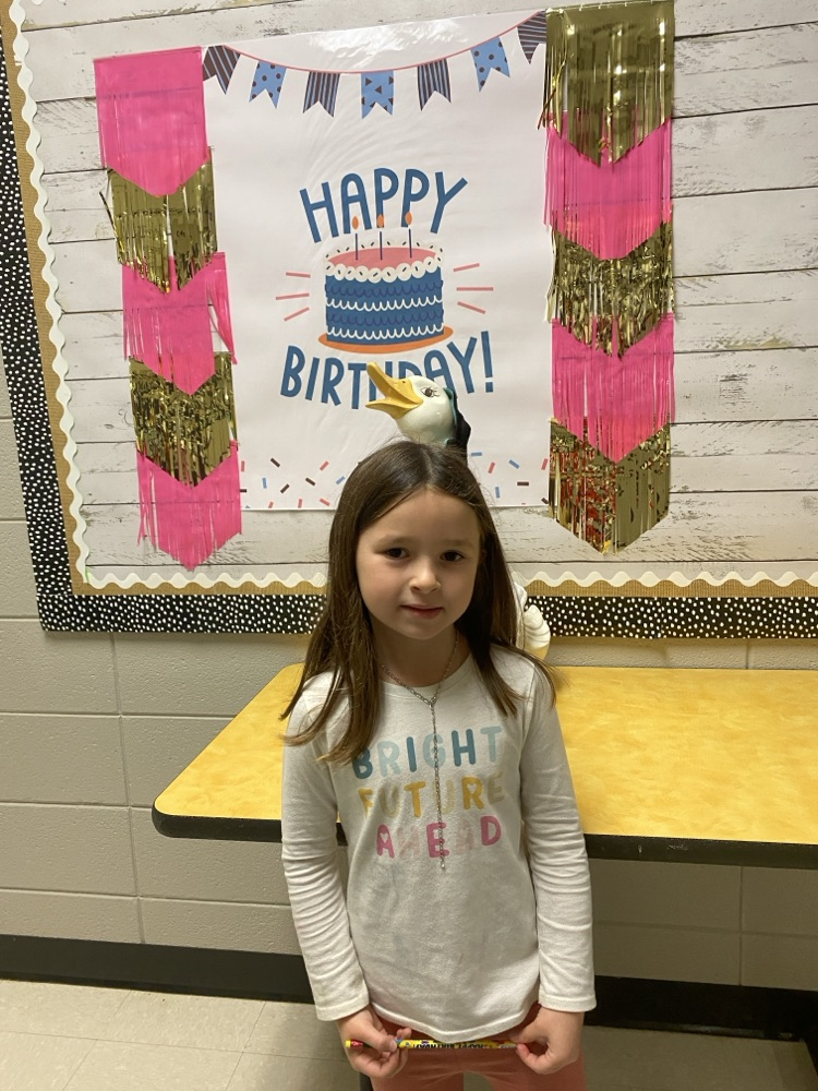 girl posing with the goose