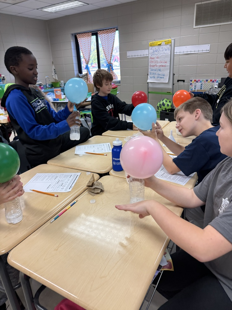 kids working on science experiment 