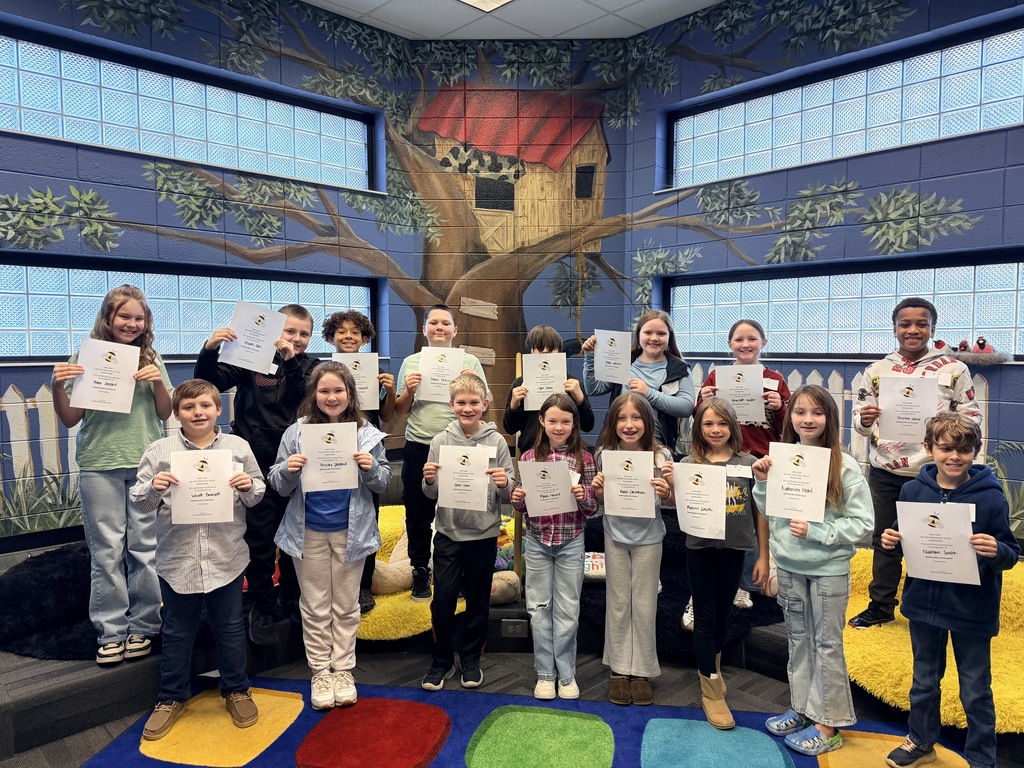 The spelling bee participants posing with their their certificates. 