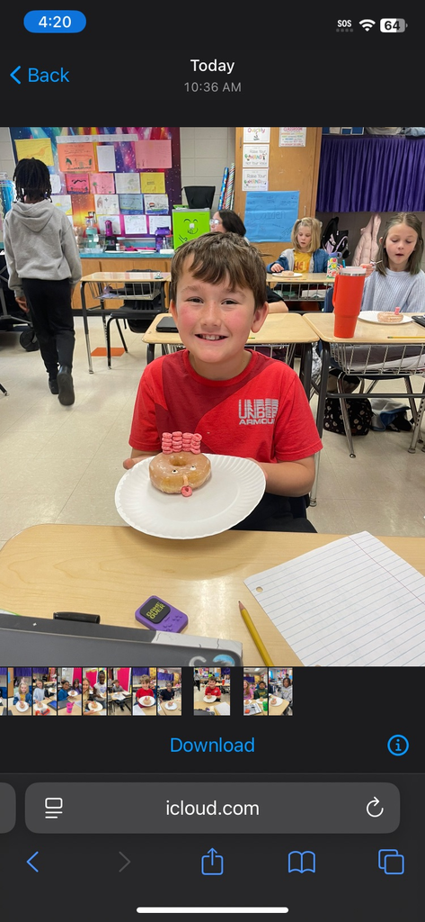 4th grade math is fun with donut turkeys!  picture of kids posing with their donut turkeys 
