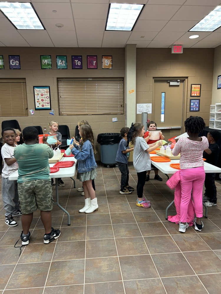 students doing hands on activities at table 