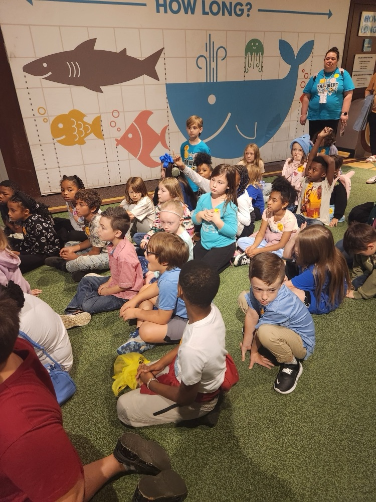 2nd grade had a wonderful on their field trip today.  students listening to the presenter at the carpet 