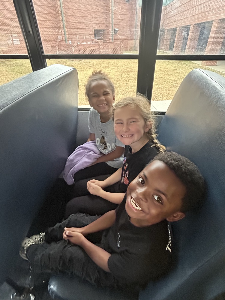 students on the bus going to the field trip 