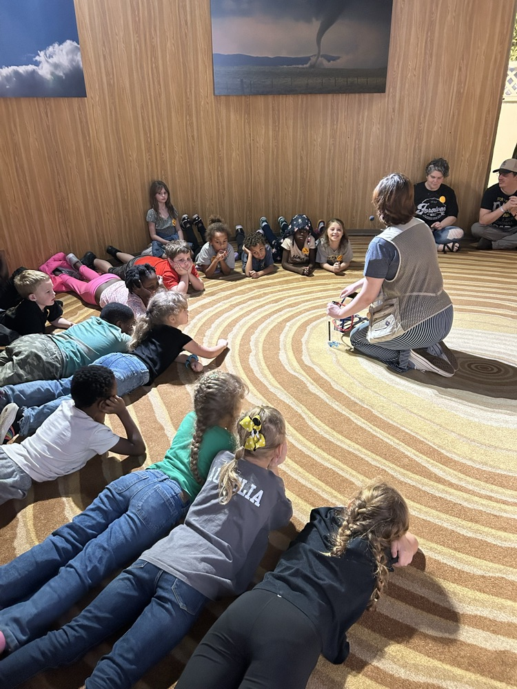 students listening to a presenter 