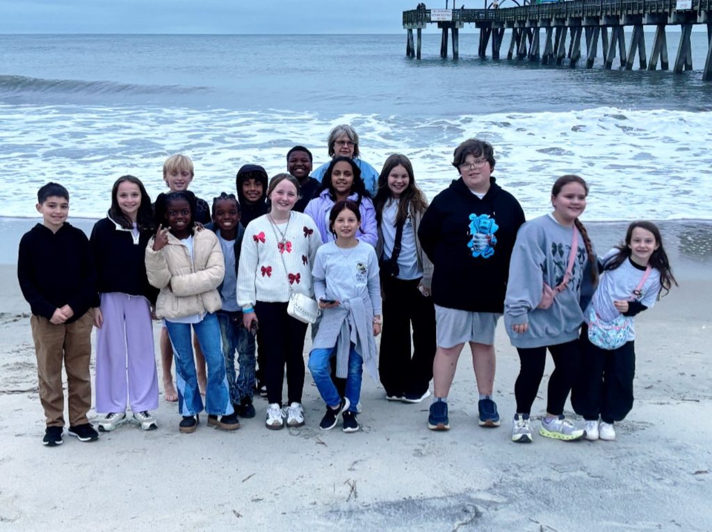 Our BETA students have had a wonderful time at the Georgia BETA Convention in Savannah. They are headed home today. The whole group of Van Wert BETA students posing in front of the ocean.