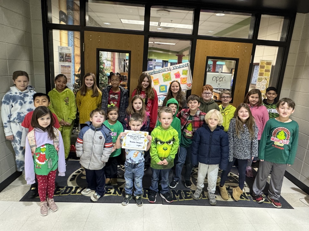 Congratulations to our November Students of the Month! If your child missed the group picture, please share a photo of him or her in the comments! Way to go!  Picture of our students of the month for Nov. posing in front of the library doors. 