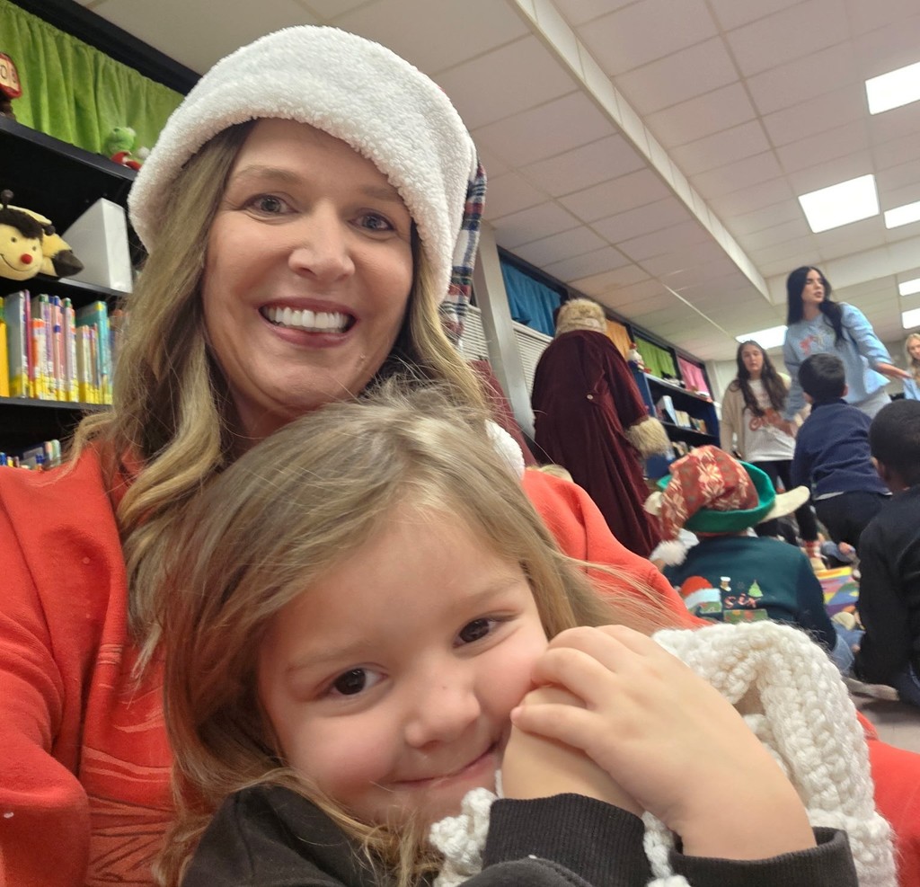 Smiling assistant principal and student.