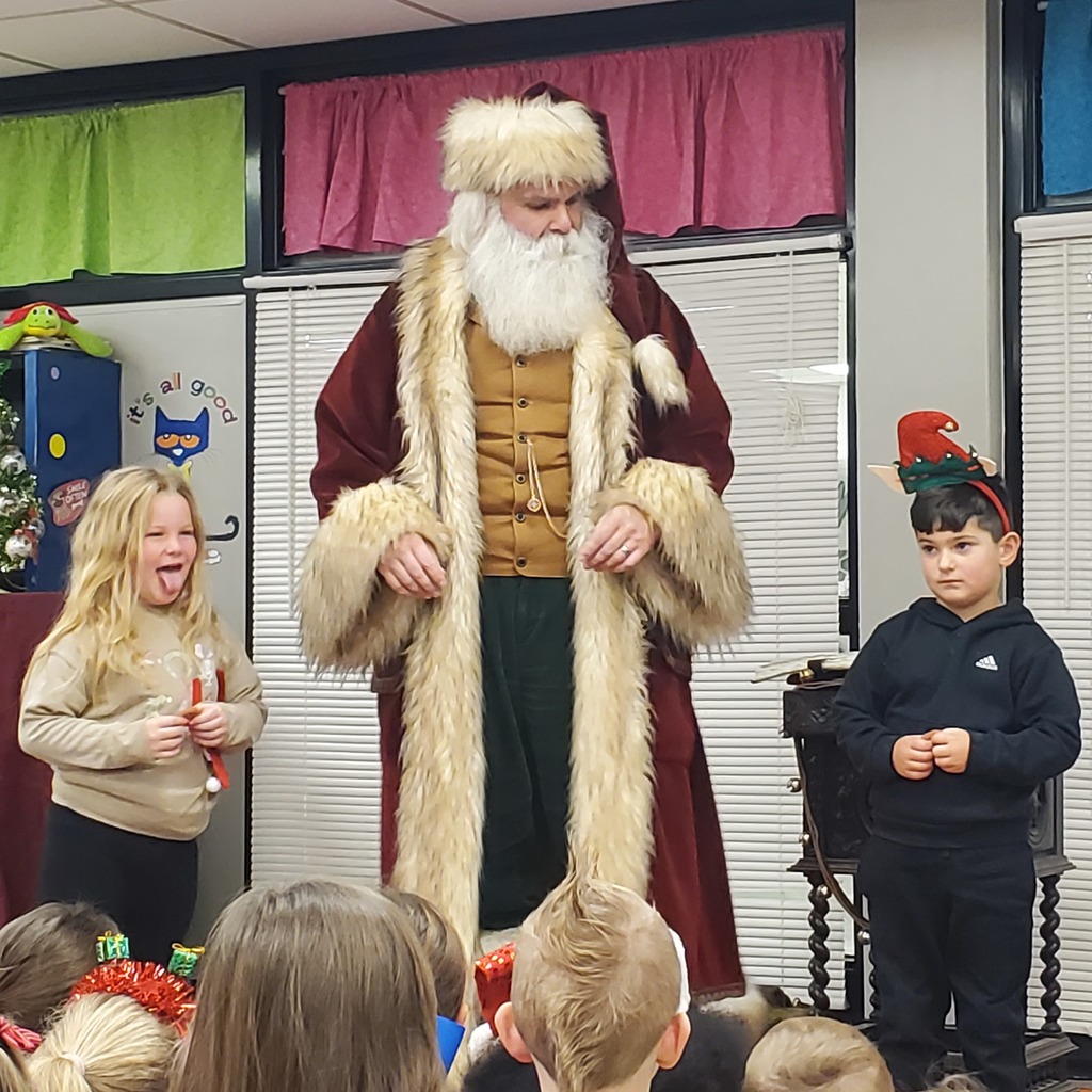 Santa speaking to students