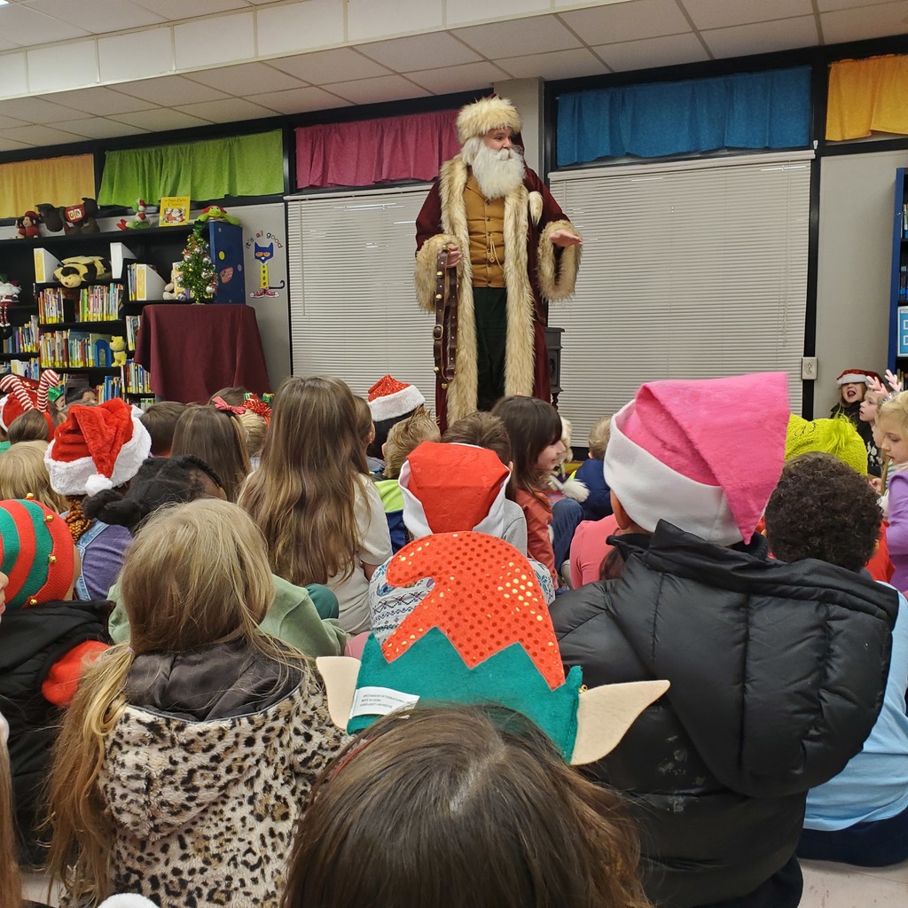 Santa speaking to students