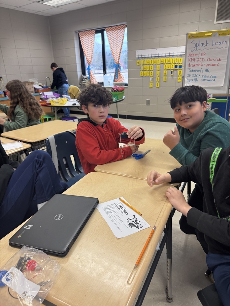 🧲 Hands-on science in action! Today, students built their very own electromagnets and discovered the amazing connection between electricity and magnetism! picture is of students working in small groups with magnets 