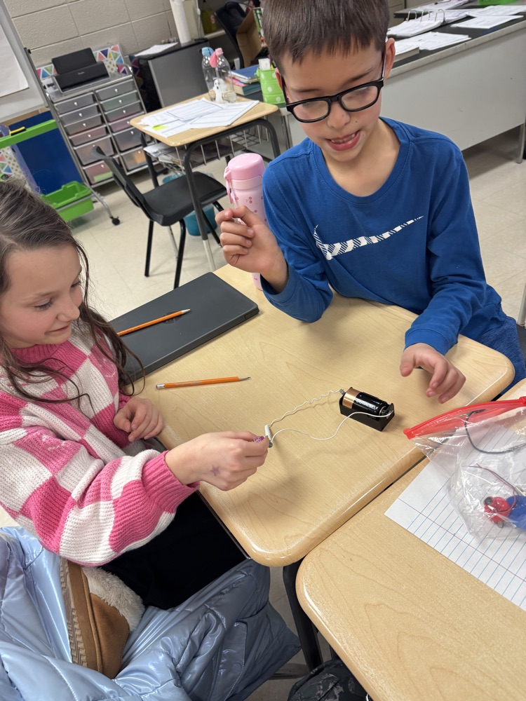 🧲 Hands-on science in action! Today, students built their very own electromagnets and discovered the amazing connection between electricity and magnetism! picture is of students working in small groups with magnets 