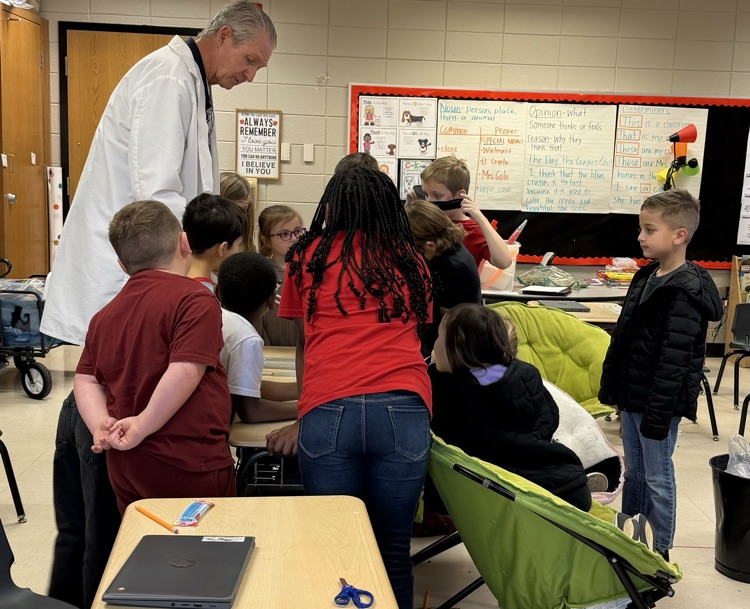 Dr. Bob visited 1st grade yesterday. #scienceisfun #learningisfun    picture of students experimenting with sound and objects to make sound with Dr. Bob in photo 