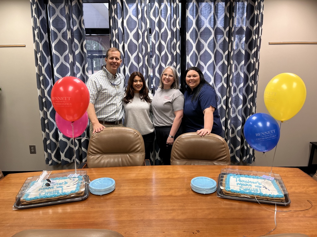 Thank you so much, Bennett Orthodontics, for the wonderful cookie cake for our faculty and staff.  This picture is a picture of the wonderful staff at Bennett Orthodontics  smiling with our cookie cakes. 