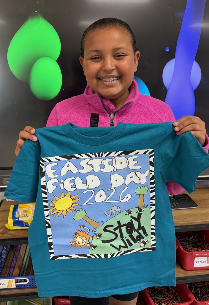 Student holding field day 2026 shirt