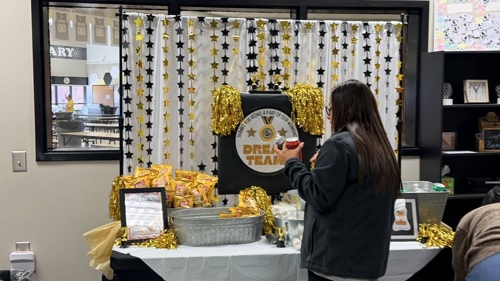 Thank you to our wonderful administrators and office staff for making the first two days of Teacher Appreciation Week so much fun! We thoroughly enjoyed El Coyote yesterday, and the snacks today were golden. #TeacherAppreciationWeek - Picture of Ms. Clanton getting her goodies/snacks. 