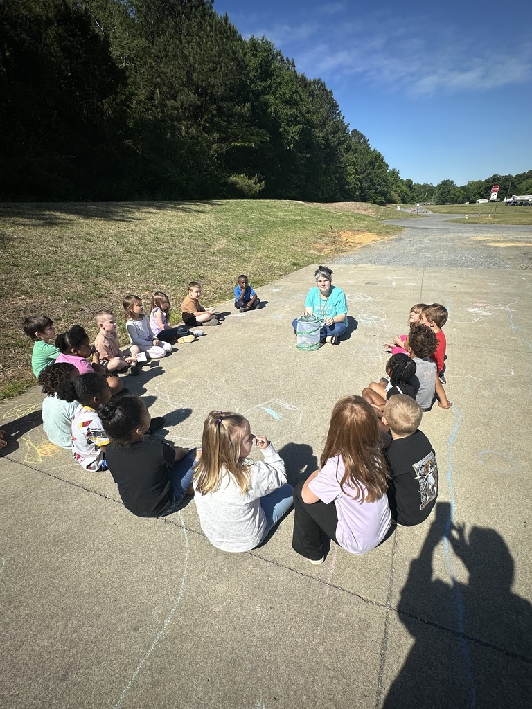 Prek students releasing butterflies