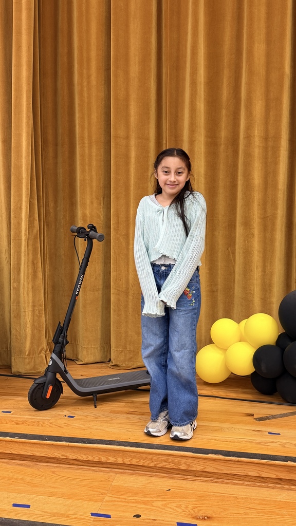 Amy with her new scooter after the drawing. 