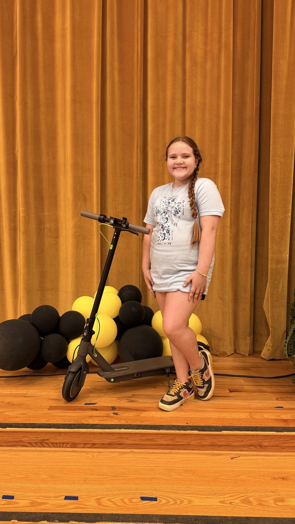Jasper with her new scooter after the drawing. 