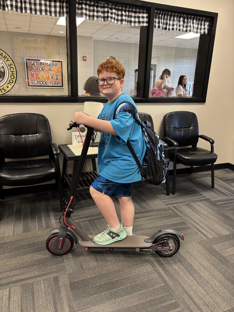 Miki with his new scooter after the drawing. 