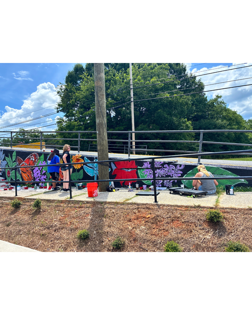 Advanced Art students/mural behind the Langford Center