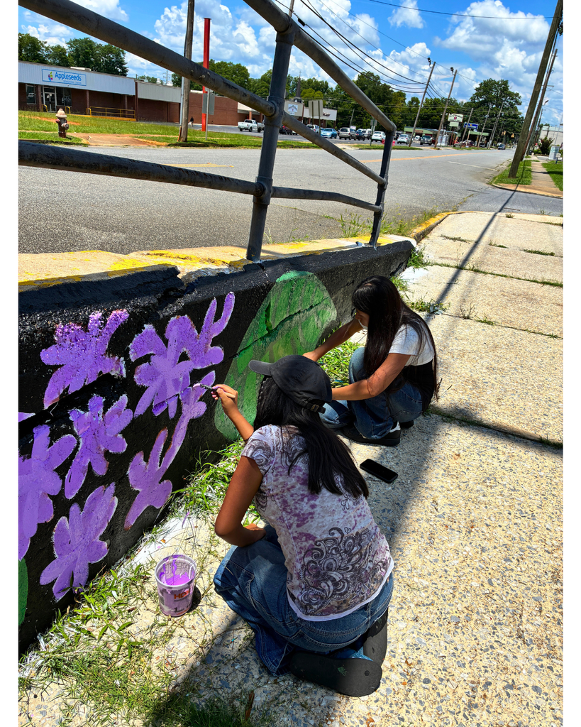 Advanced Art students/mural behind the Langford Center