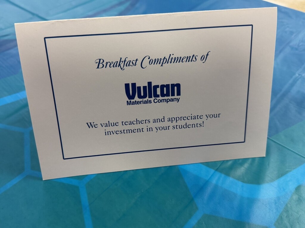 Sign that states "Breakfast Compliments of Vulcan Materials Company"