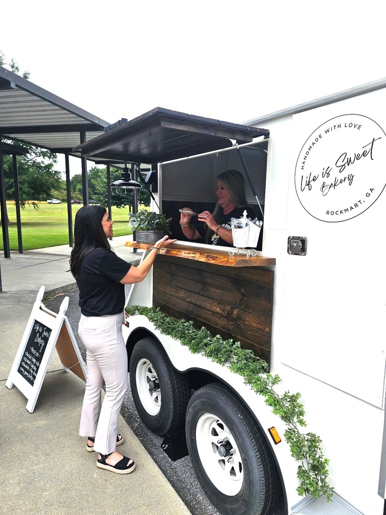 Our teachers getting treats from Mrs. Morris' Life is Sweet mobile stand. 