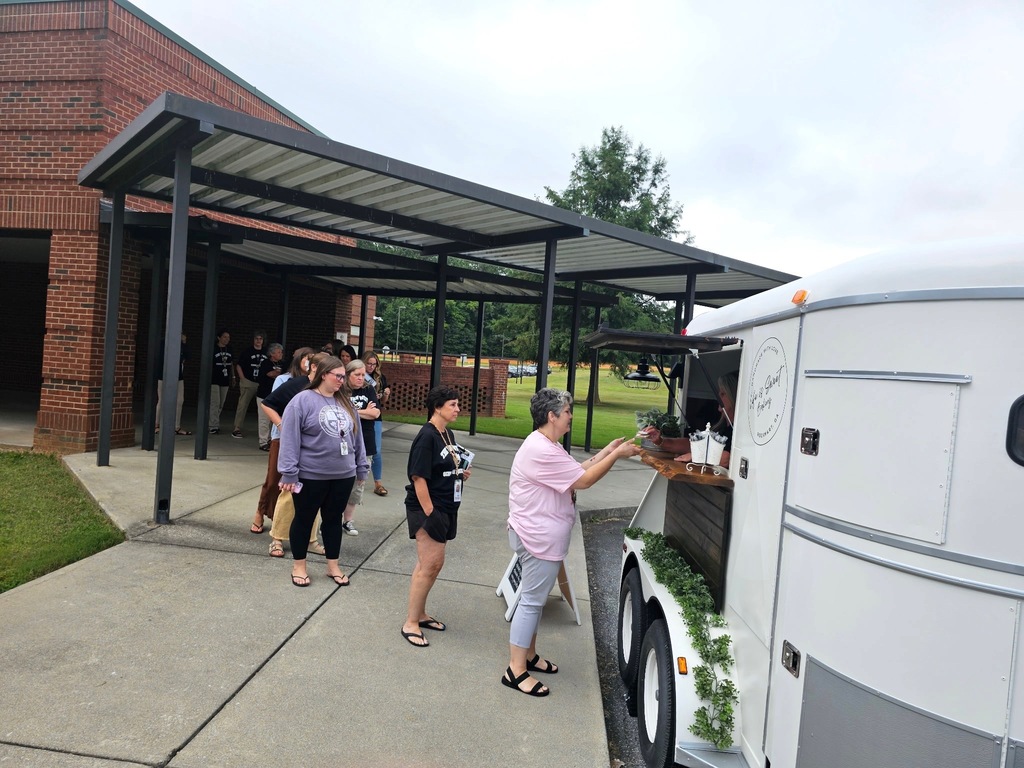 Our teachers getting treats from Mrs. Morris' Life is Sweet mobile stand. 