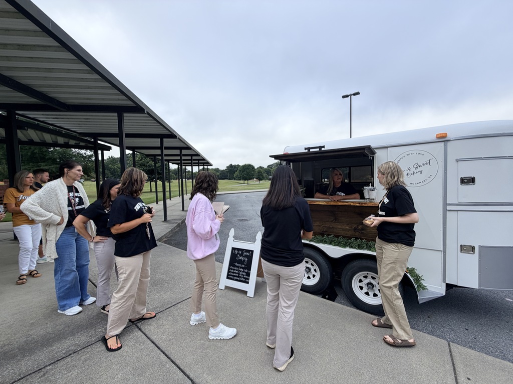 Our teachers getting treats from Mrs. Morris' Life is Sweet mobile stand. 