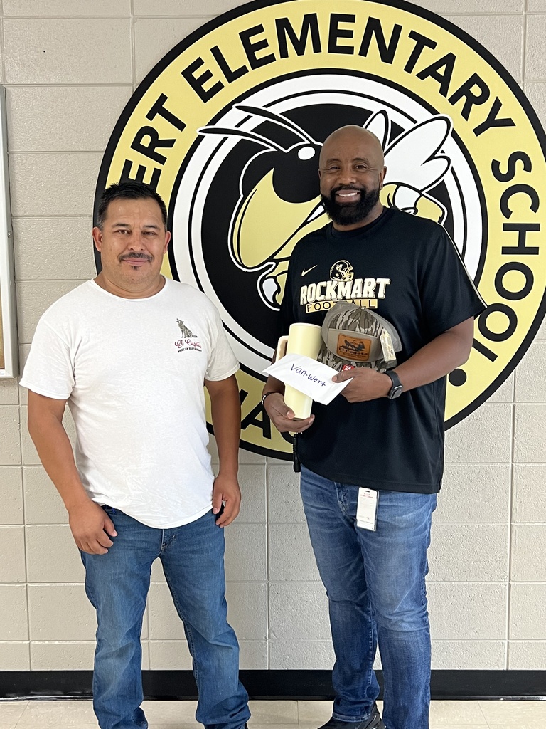 Picture is of Mr. Z and German posing for a photo in front of the Van Wert Jackets sign. Thank you, German, from El Coyote Mexican Restaurant, for the wonderful gift cards, hats, and cups for our staff.