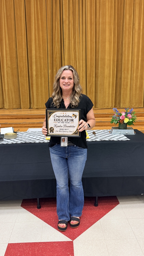 Mrs. Kendra Brumbelow our TOTY holding her picture frame with a teacher of the year certificate. 