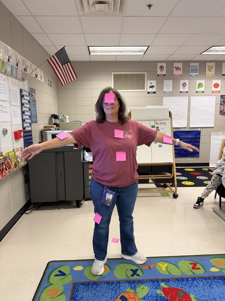 Mrs. Ring with labels on her. Ms. Ring's kindergarten class is having lots of fun learning about labeling and which objects sink or float.