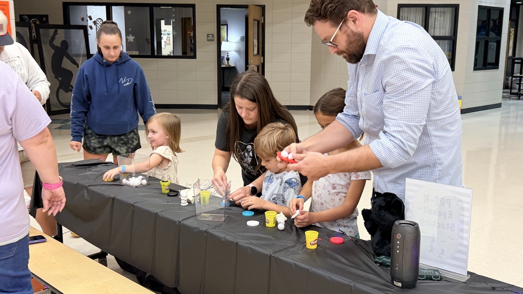 v🍂🔬💛 What a FANTASTIC STEM Fall Carnival Night at Van Wert Elementary School! 🖤🐝 A huge THANK YOU to Mrs. Garcia for leading last night's events, and thank you to our wonderful parents, family members, and community members who joined us yesterday for an evening of STEM learning, fall fun, and unforgettable memories! 🎃🧪🍁.  Picture of students stacking eyeballs up with playdoh