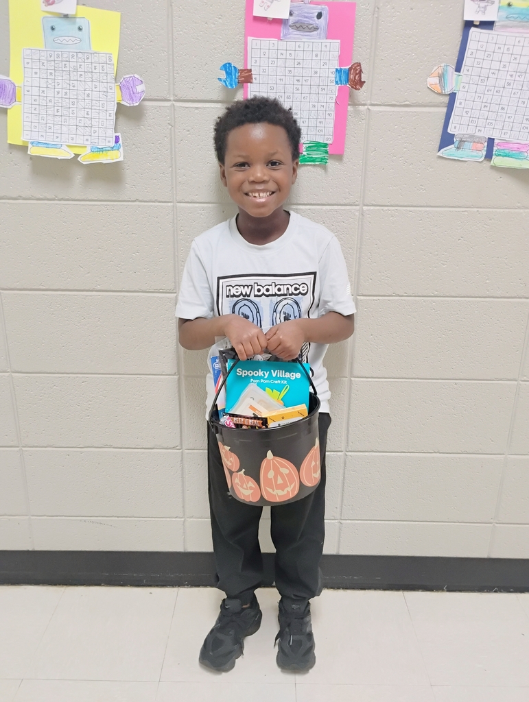 We have a Boo Basket winner! A big congratulations to Messiah Ware for completing our Title 1 Survey during our Fall STEM Carnival!  Thank you to everyone who took the time to complete the survey and share your feedback with us. Your input helps us continue to make Van Wert Elementary an even better place for our students and families!  Enjoy your boo basket, Messiah!  Picture of Messiah with his boo basket. 