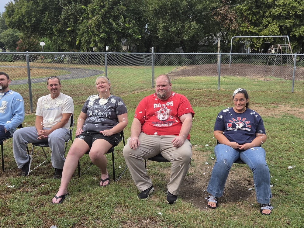 Teachers at Wildcat Academy getting pied in the face