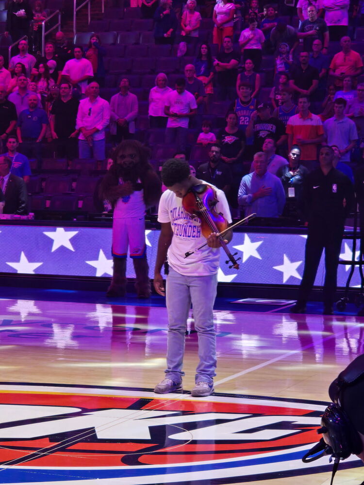 Po-Hi Junior, Treyson Rabb, performs the National Anthem on his violin at the Oklahoma City Thunder game