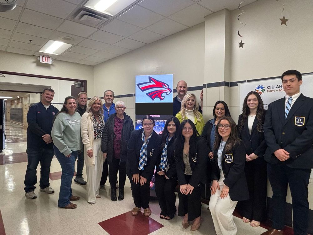 Photo of guests and deca students