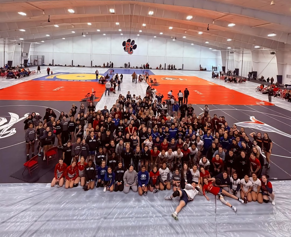 group phot of the girls wrestling teams that attended the tournament