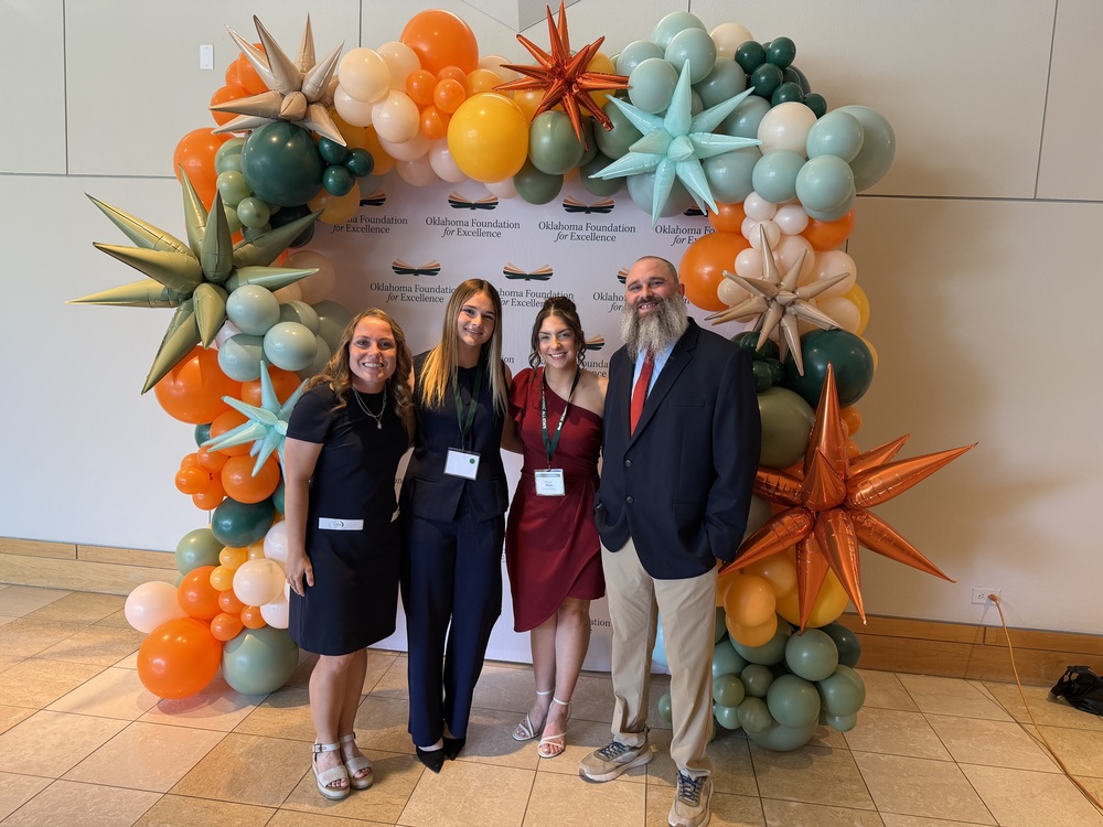 photo of sydney and madison with their chosen teachers at the banquet